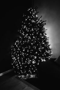 Low angle view of illuminated christmas tree at night