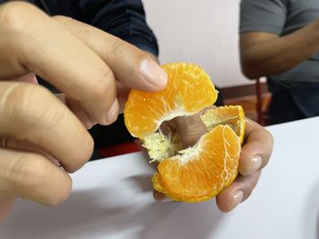 Midsection of man holding ice cream