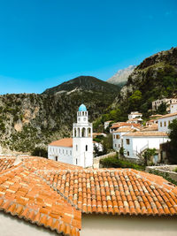 Buildings against blue sky. traditional houses of dhërmi 