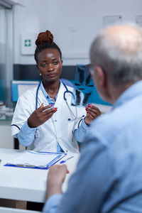 Doctor consulting with patient in clinic