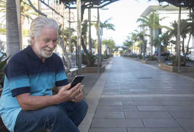 Man sitting on mobile phone