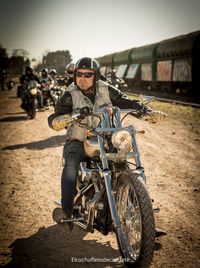 Man riding motorcycle on road