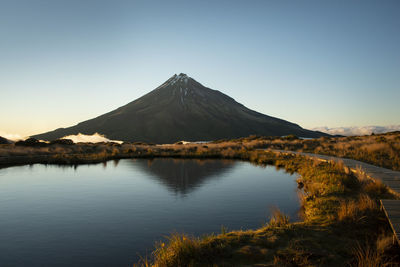 Scenic view of snowcapped mountains against clear sky