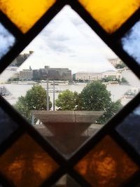 View of cityscape through window