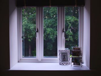 Picture frame on window sill at home