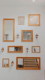 Low angle view of mirrors on wall at home