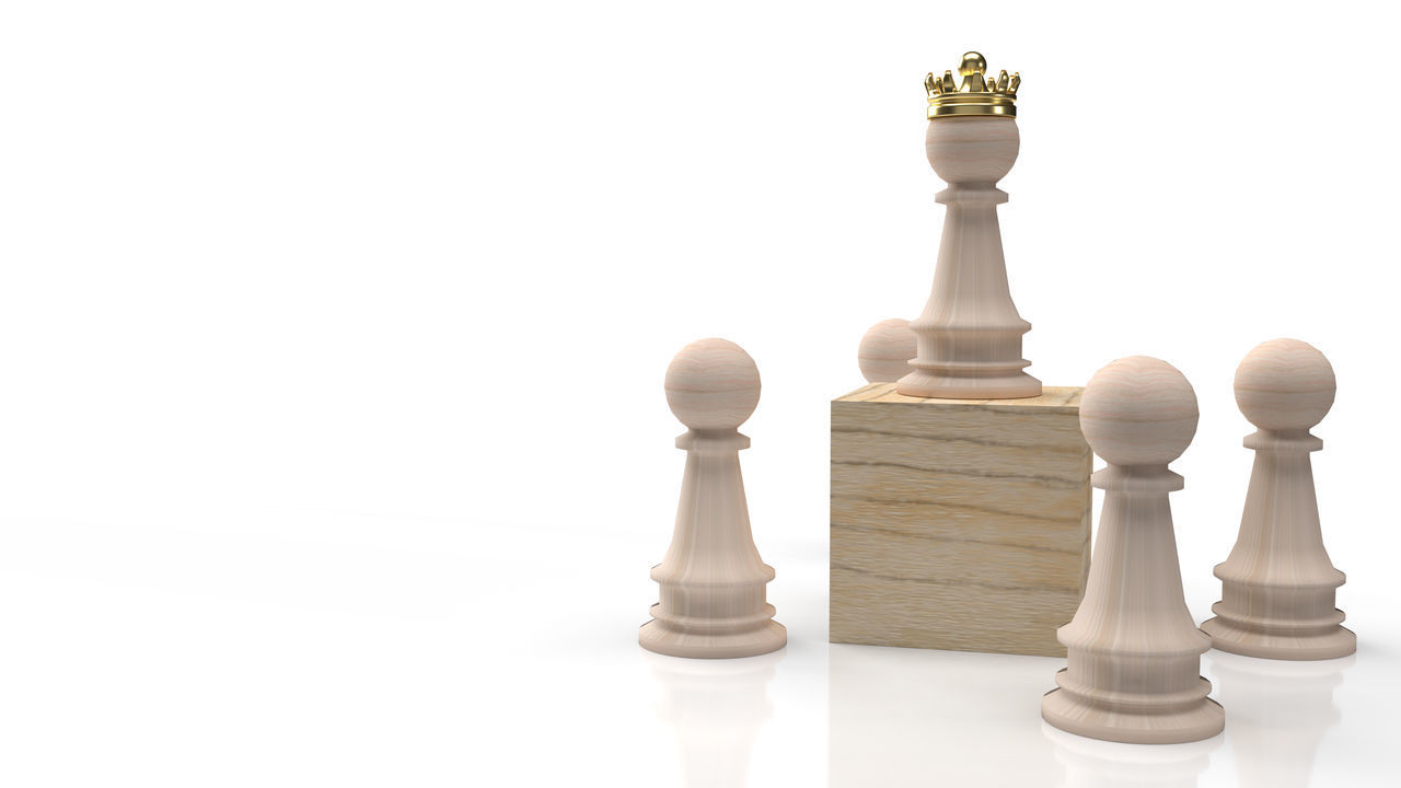 LOW ANGLE VIEW OF CHESS PIECES ON WHITE BACKGROUND