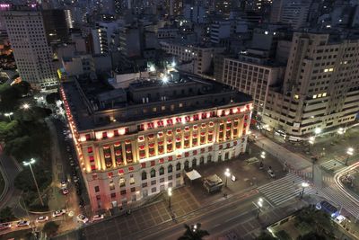 High angle view of illuminated buildings in city