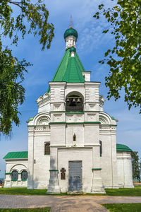 Low angle view of clock tower against sky