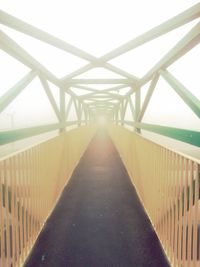 View of footbridge in foggy weather