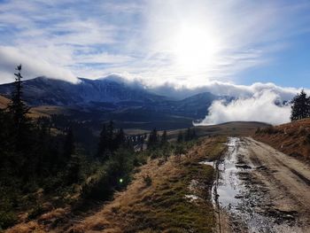 Scenic view of snowcapped mountains against sky