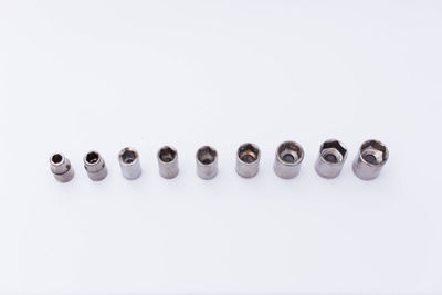 High angle view of various buttons against white background
