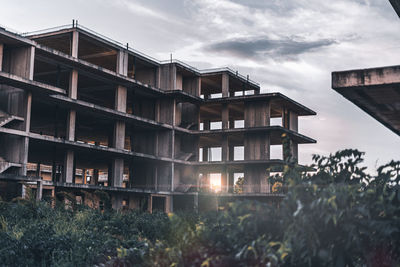 Low angle view of buildings against sky during sunset