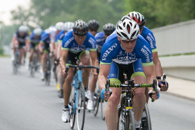 Group of people riding bicycle