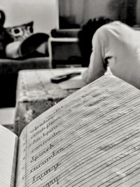 Close-up of man reading book