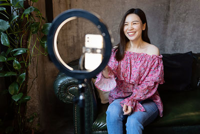 Portrait of smiling young woman