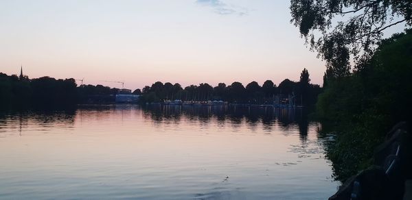 Scenic view of lake against sky during sunset