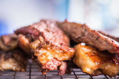 Close-up of meat on barbecue grill