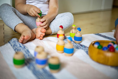 Midsection of baby playing with hands