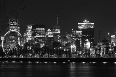 Illuminated buildings in city at night