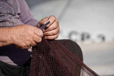 Close-up of man holding hands