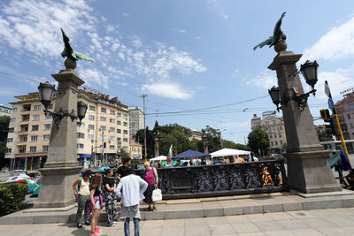 People standing against buildings in city