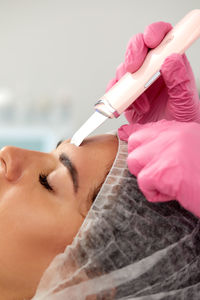 Cropped hand of doctor holding dental equipment
