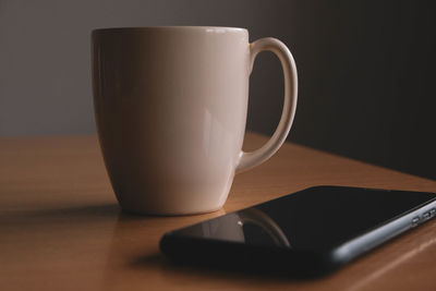 Close-up of coffee cup on table