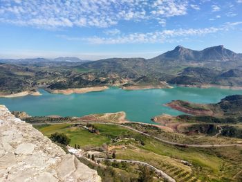 Scenic view of lake and mountains against sky