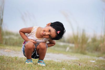 Portrait of happy boy on field