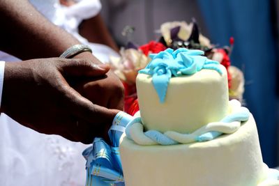 Close-up of hand holding ice cream