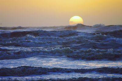 Scenic view of sea at sunset