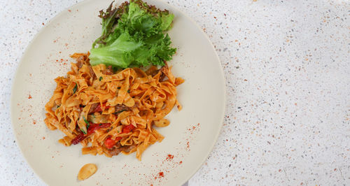 High angle view of pasta in plate on table