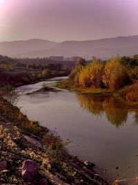 Scenic view of lake against sky during autumn