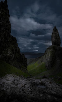 Rock formation on land against sky