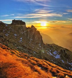 Scenic view of landscape against sky during sunset