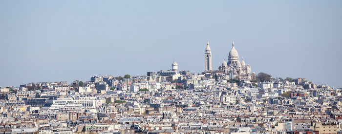 Aerial view of townscape against clear sky