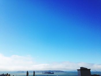 Scenic view of sea against blue sky