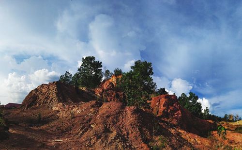 Low angle view of rock formation against sky