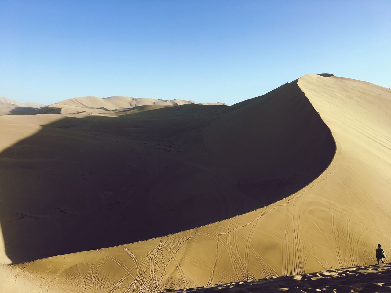 clear sky, tranquil scene, tranquility, scenics, copy space, blue, beauty in nature, mountain, water, nature, remote, day, outdoors, non-urban scene, arid climate, calm, physical geography, no people, mountain range, majestic, natural landmark, solitude, geology, extreme terrain, long