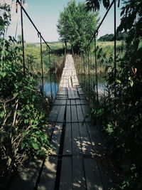 Rustic narrow bridge over river