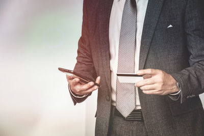 Close-up of man using mobile phone