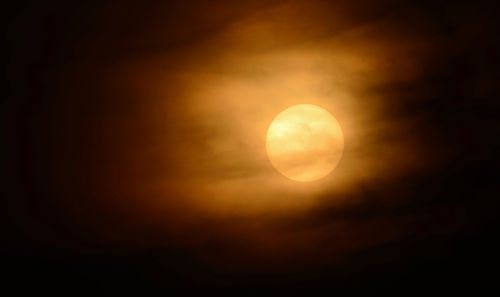 Scenic view of moon against sky during sunset