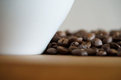 Close-up of coffee beans on table