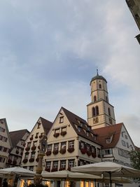 Low angle view of buildings in city against sky