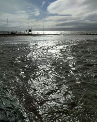 Scenic view of sea against cloudy sky