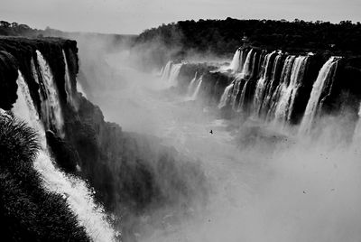 Scenic view of waterfall against clear sky