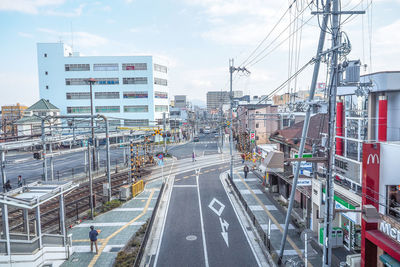 Panoramic view of road in city against sky