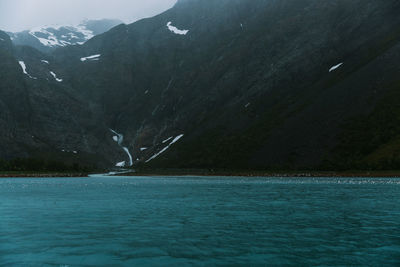 Scenic view of sea against mountains