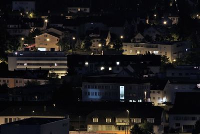 High angle view of illuminated buildings in town
